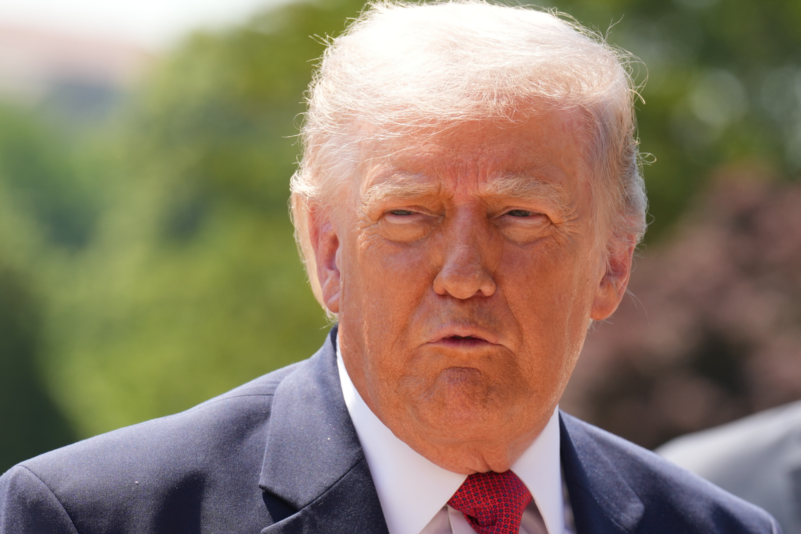 President Donald Trump speaks as he tours Ballroom construction around the outside the White House, Tuesday, May 19, 2026, in Washington.
