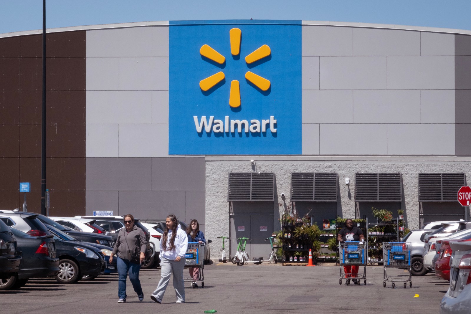 Customers shop at a Walmart store on May 13, 2026 in Chicago, Illinois.